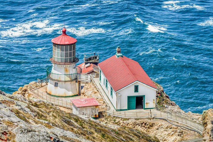 Explore the stunning coastline of Point Reyes where the historic lighthouse stands sentinel over crashing waves inviting travelers to uncover tales of maritime adventures and breathtaking ocean views.
